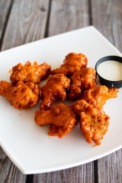 Buffalo Wings · 1 lb. of wings served with your choice of classic Buffalo, gochujang, honey Sriracha, sweet Thai chili, BBQ, or teriyaki sauce served with homemade ranch dressing.