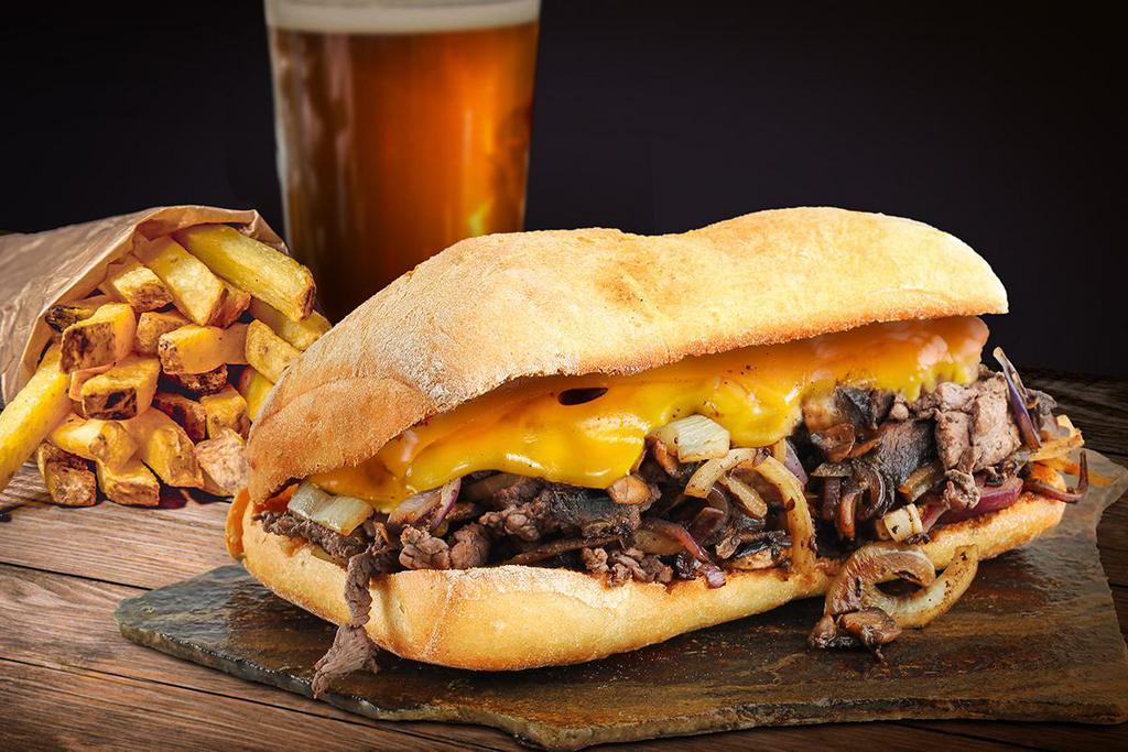 Filet Mignon Sandwich · Sliced Filet Mignon topped with sautéed onions, Cheddar cheese, and house-made chipotle mayo.