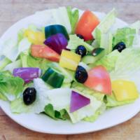House Salad · Romaine lettuce, tomatoes, onions, cucumbers and Moroccan cured olives in a house balsamic v...