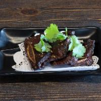 Korean Kalbi Beef · Marinated short rib in spicy Korean sauce. Served with miso soup and white rice. Hot and spi...