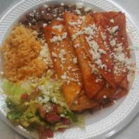 3. Enchilada Plate · Chicken and cheese with a side of rice, beans, lettuce, pico de gallo and sour cream.