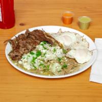 Chilaquiles con Huevo · Chilaquiles with sour cream, cheese, onions, and two sunny up side eggs OR steak