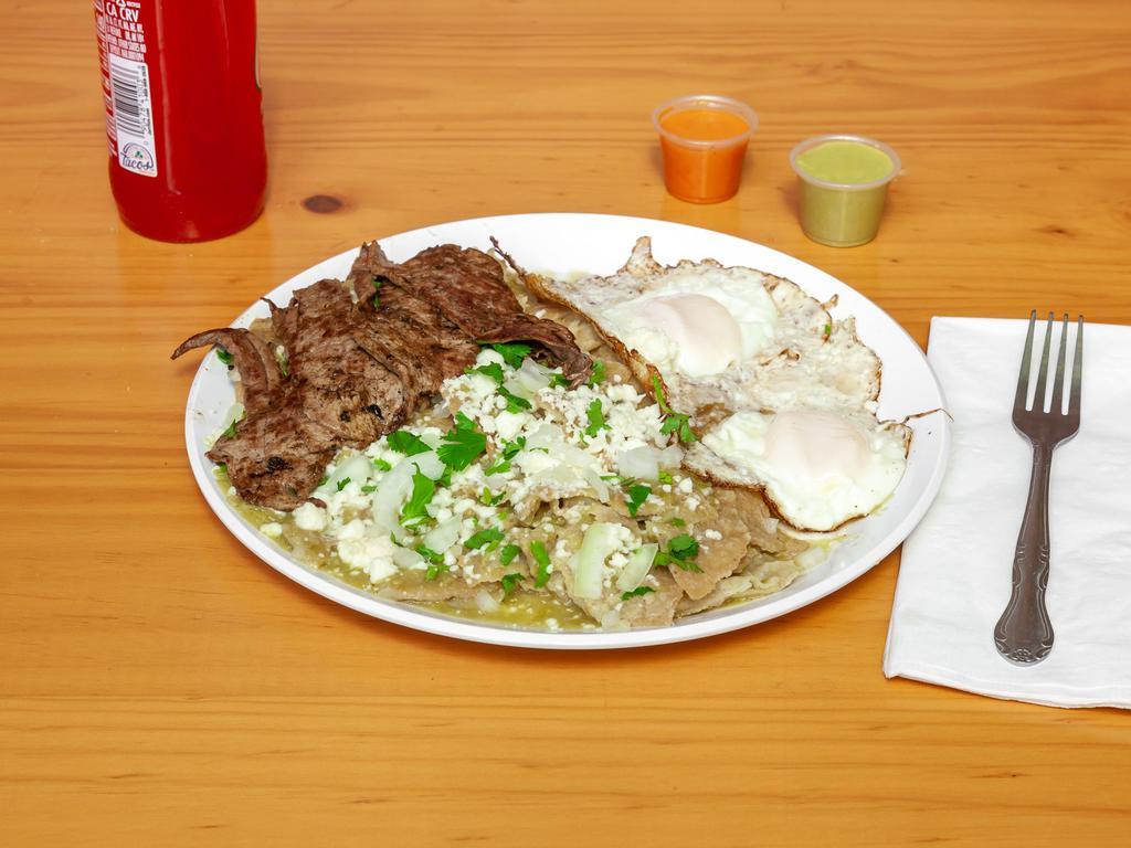 Chilaquiles con Huevo · Chilaquiles with sour cream, cheese, onions, and two sunny up side eggs OR steak