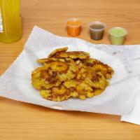 Tostones · Plantains that have been smashed and fried 