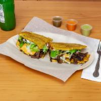 Steak Jibarito · Lettuce, tomato, yellow cheese, grilled onions, mayonnaise, garlic on the side.