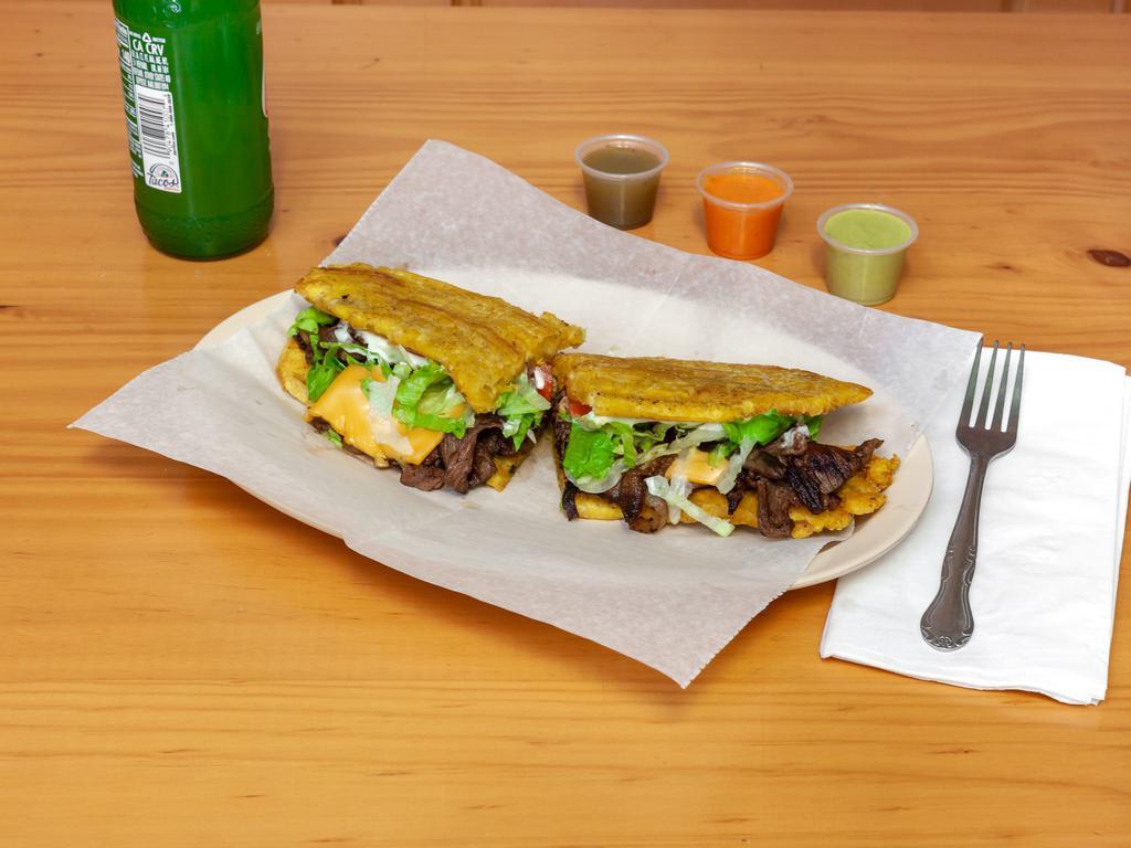 Steak Jibarito · Lettuce, tomato, yellow cheese, grilled onions, mayonnaise, garlic on the side.