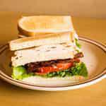Club House Sandwich · Crisp bacon, turkey with lettuce. Add cheese for an additional charge.