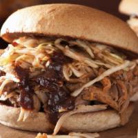 Pulled Pork Sandwich · Slow smoked pulled pork with your choice of sauce and Carolina coleslaw on a toasted Kaiser....