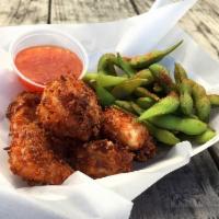 Coconut Shrimp (6) · Panko breaded coconut crusted shrimp served with sweet chili sauce and spicy edamame.