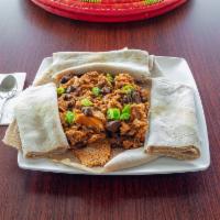 Kuanta Firfir · Bits of injera soaked in a rich sauce with beef jerky.
