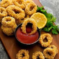 Fried Calamari · Fried squid with a side of a sweet and spicy chili sauce.