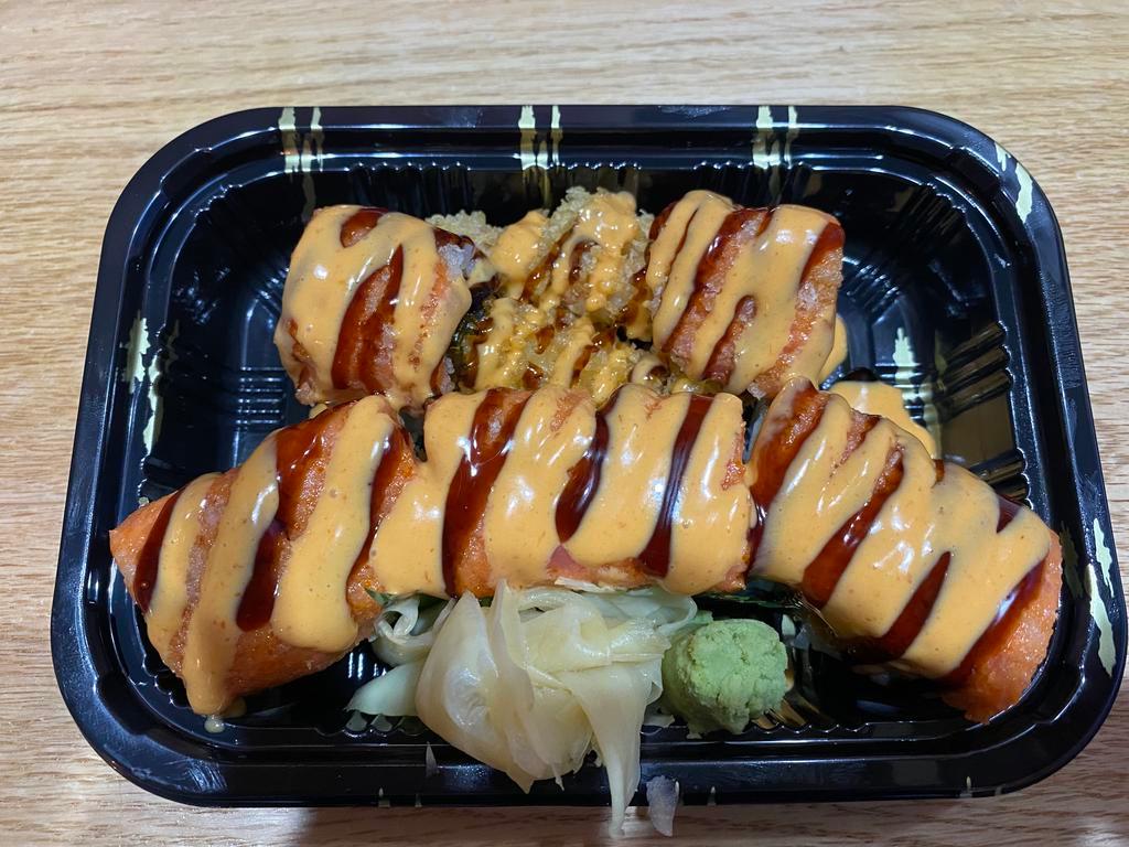 Fire Dragon Roll · Shrimp tempura inside, spicy tuna, crunch and fish roe on top, spicy mayo and eel sauce.