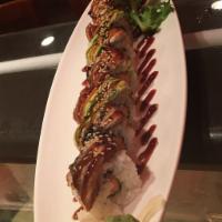 Godzilla Roll · Spicy tuna & crunch inside, eel & avocado on top.