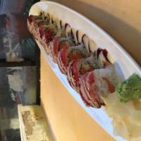 Amazing Tuna Roll · Spicy tuna, tempura white fish and avocado inside, pepper tuna on top with eel sauce and spi...