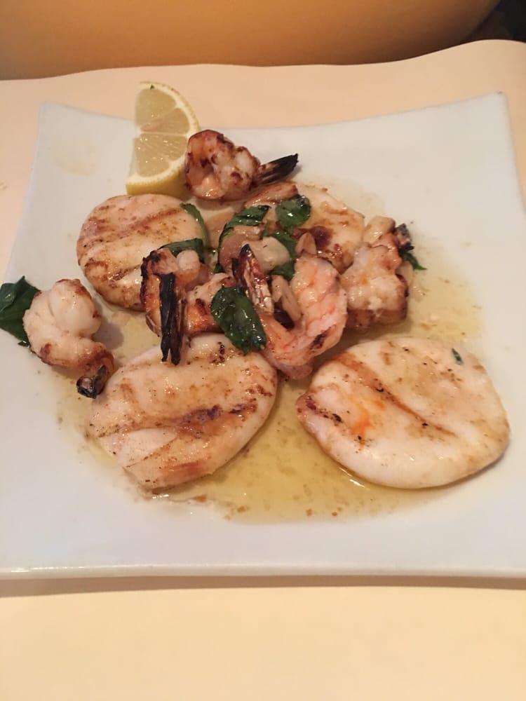 Grilled Calamari and Shrimp · Topped with garlic, fresh lemon juice and olive oil.