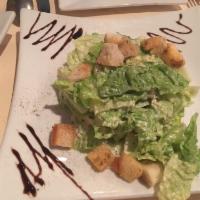 Insalata Romana · Our homemade Caesar dressing with romaine lettuce, garnished with toasted crostini, Asiago, ...