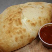 Ricotta Calzone · Stuffed with ricotta and mozzarella. Add toppings for an additional charge.