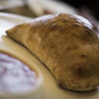 Chicken Calzone · Stuffed with ricotta and mozzarella and chicken, Add toppings for an additional charge.