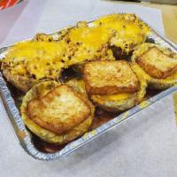Mofonguito · Fried plantain cups topped with your choice of meat, cheese, and drizzled with with house ma...