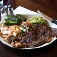 Bistec Poblano Platillos · Grilled rib eye steak, pico de gallo, guacamole, cheese and grilled peppers. Served with ric...