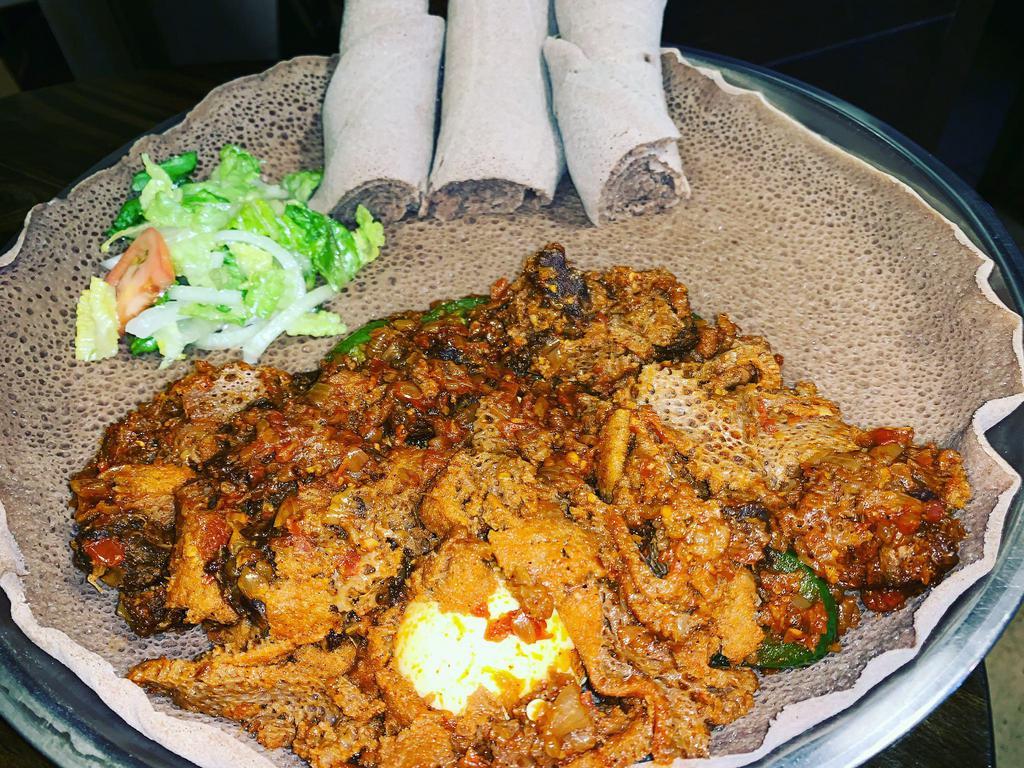 Quanta Firfir  · Bite sized fresh dried beef cooked with onion, jalapenos, garlic, and mixed with injera Served with boiled eggs.
