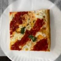 Grandma Sicilian Pizza Slice · Made with fresh mozzarella and tomato sauce thing crust square 