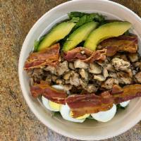 Cobb Salad · Grilled chicken, bacon, hard boiled egg and avocado over mixed greens.
