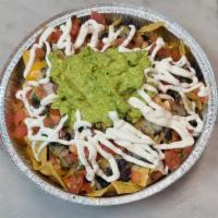 Súper nacho · Beans,guacamole, sour cream, pico de Gallo and cheese 