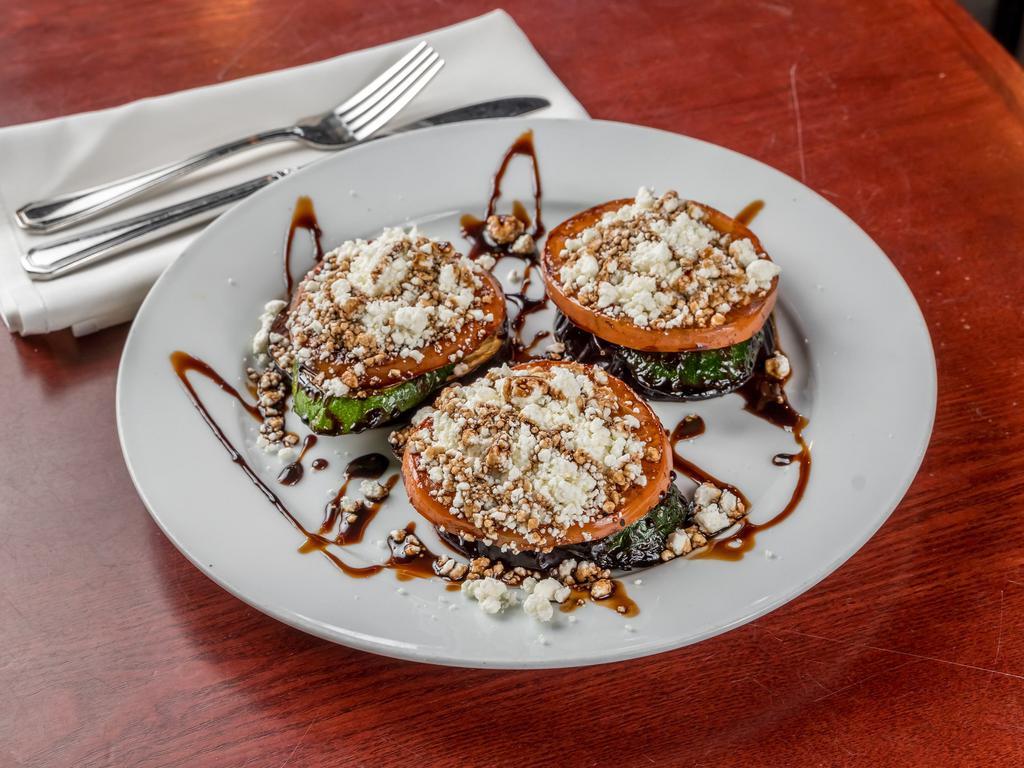 Goat Cheese Tower · Grilled eggplant, zucchini, tomatoes, & goat cheese glazed with balsamic reduction.