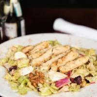 Sonny’s Chopped Gourmet Salad · Served with chopped romaine, red onions, walnuts, raisins, roasted peppers, & fresh mozzarel...