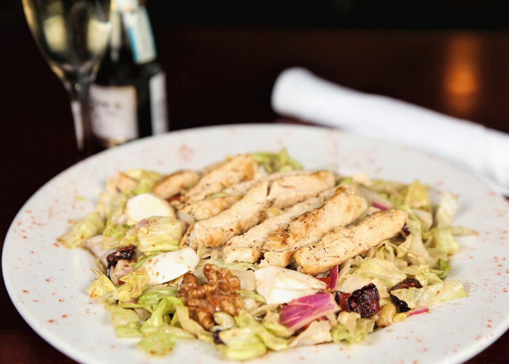 Sonny’s Chopped Gourmet Salad · Served with chopped romaine, red onions, walnuts, raisins, roasted peppers, & fresh mozzarella in honey balsamic.