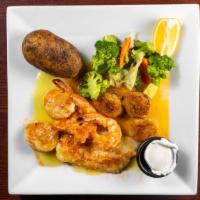 Broiled Seafood Combo · Jumbo shrimp, ocean scallops, flounder & baked clams with baked potato & vegetables.