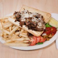 Philadelphia Steak and Cheese Sub Platter · Thinly sliced steak with grilled onions, grilled mushrooms and provolone cheese served with ...