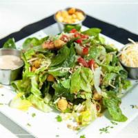 Caesar Salad · Romaine lettuce, spinach sunflower seeds, croutons, tomato, Parmesan cheese, and light Caesa...