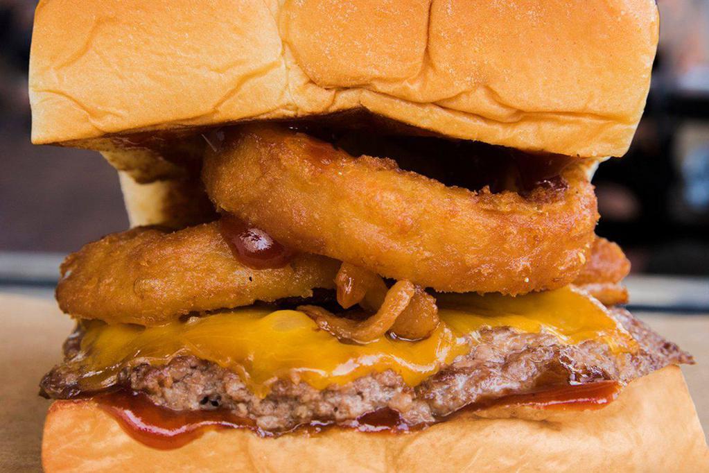 RINGER · cheddar cheese, smoked bacon, onion rings, bbq sauce