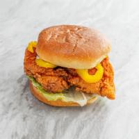 Szechuan Hot Fried Chicken Sandwich · Deep fried chicken thigh dusted in Szechuan spice. Served on a potato roll with mayo, lettuc...