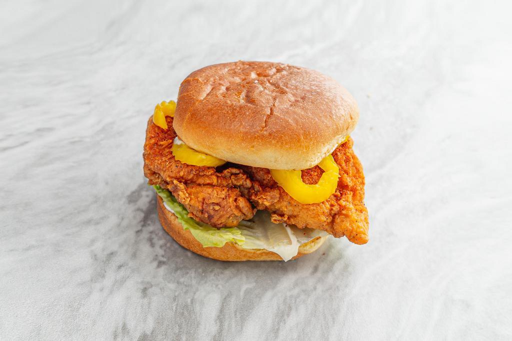 Szechuan Hot Fried Chicken Sandwich · Deep fried chicken thigh dusted in Szechuan spice. Served on a potato roll with mayo, lettuce, and banana peppers. 
Contains: Gluten, Eggs