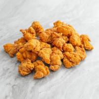 Popcorn Chicken. · Bite-sized boneless fried chicken, served with your choice of dipping sauce on the side.
Con...