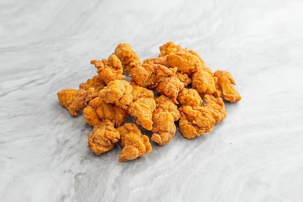 Popcorn Chicken. · Bite-sized boneless fried chicken, served with your choice of dipping sauce on the side.
Contains: Gluten