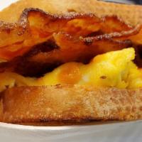 Bacon Egg and Cheese Sandwich · Brown sugar bacon, scrambled eggs and cheese on toast, served with a side of hash browns