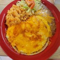 Huevos Rancheros · 3 eggs over easy on corn tortillas covered with Jack cheese and Spanish sauce. Garnished wit...