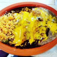 Enchiladas de Mole · 3 corn tortillas rolled and stuffed with chicken, beef, cheese or shredded beef. Topped with...