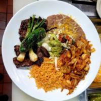 Carne Asada con Camarones · Tender, flame-broiled steak and shrimp sauteed sauce with garlic and spices. Served with gua...