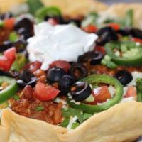 Taco Salad · Turkey chili, tomatoes, jalapenos, scallions, olives, pepper jack queso, sour cream and chip...