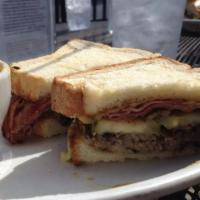 Cuban Sandwich · Roasted pork, ham, Swiss cheese, secret sauce, spicy mustard and pickles on Texas toast. Ser...