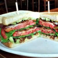 Salmon BLT Sandwich · Grilled salmon fillet, bacon, lettuce, tomato and dill aioli on Texas toast. Served with you...