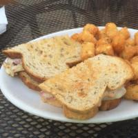 Reuben Sandwich · Your choice of corned beef or turkey with sauerkraut, Swiss cheese and 1000 Island on rye br...