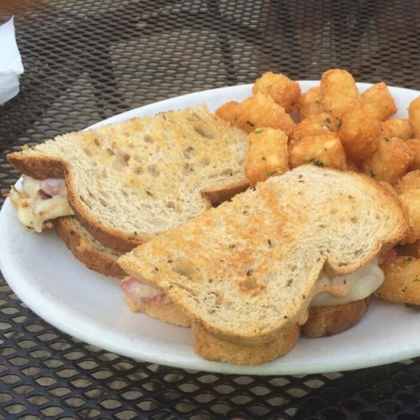 Reuben Sandwich · Your choice of corned beef or turkey with sauerkraut, Swiss cheese and 1000 Island on rye bread. Served with your choice of side.