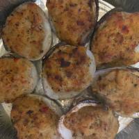 Ultimate Clams Casino · Claims stuffed with a delicious crabmeat, peppers, onions, and bacon mixture. Topped with se...