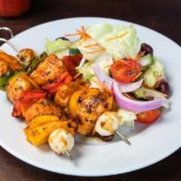 Chicken Kabob · Marinated grilled chicken kabob skewered with pearl onion and bell peppers.